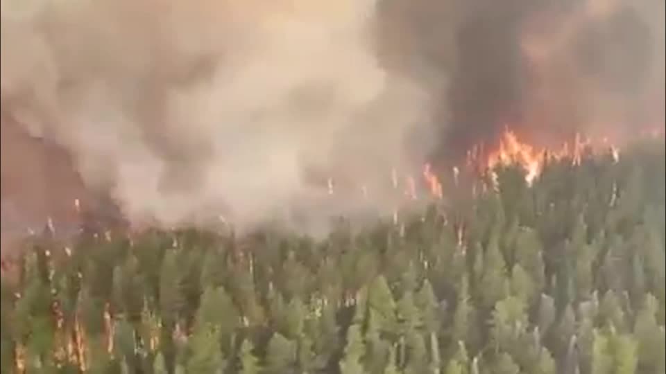Exhausted crews battle Canadian wildfires as experts issue climate warning